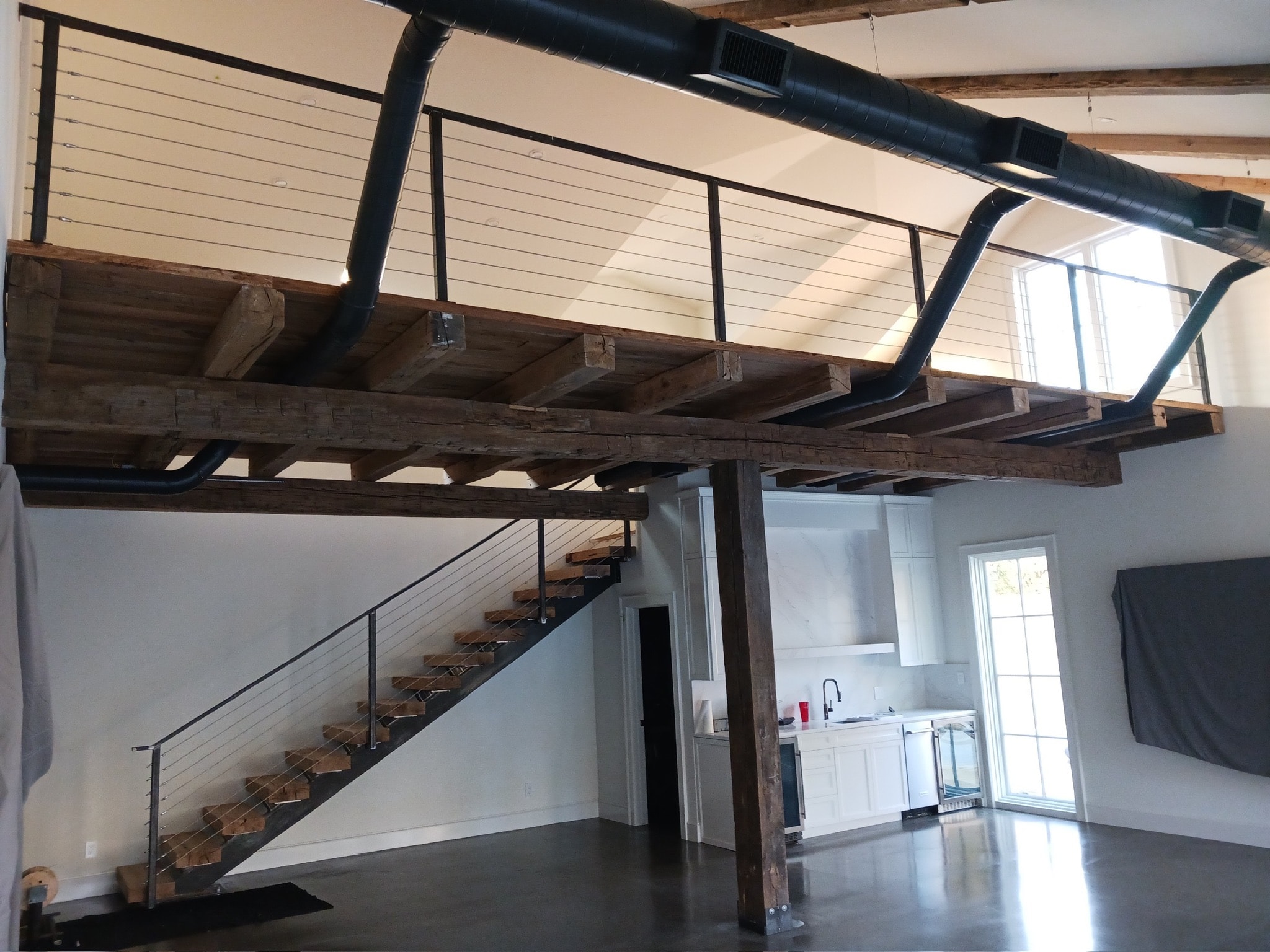 Cable rail staircase and loft guard fabricated by Claudio Welding